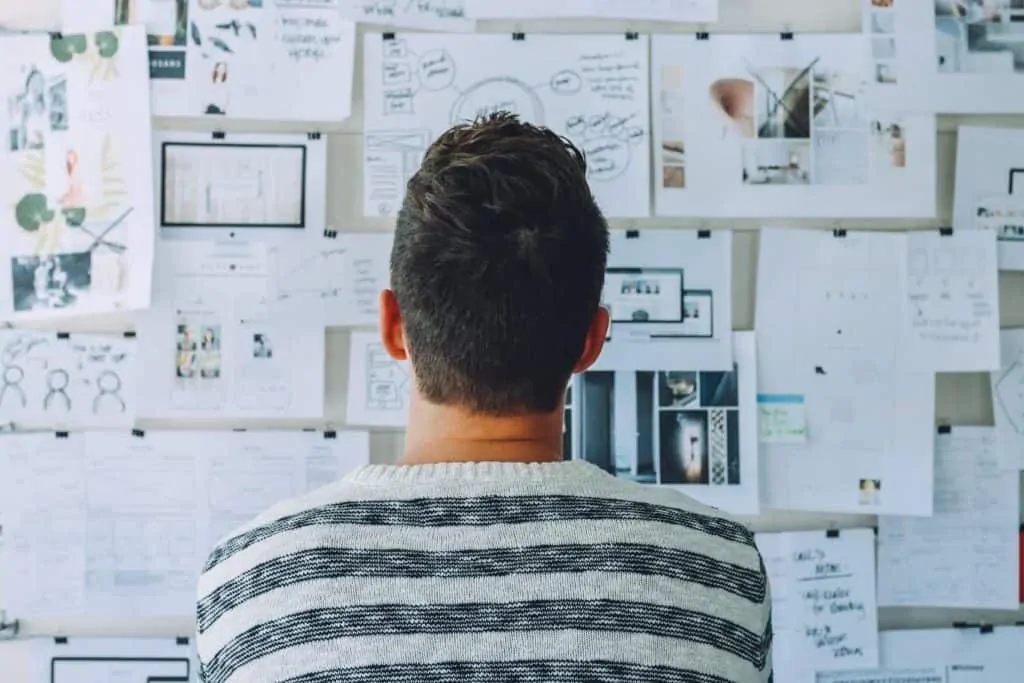 Person looking at wall of plans