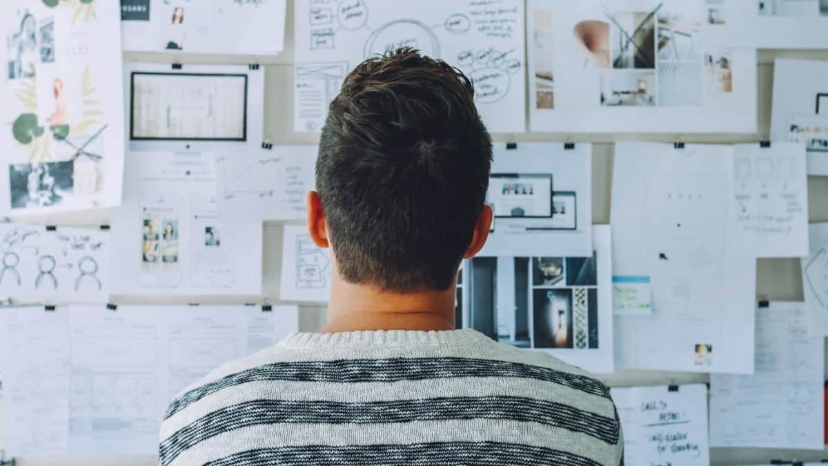 Person looking at wall of plans