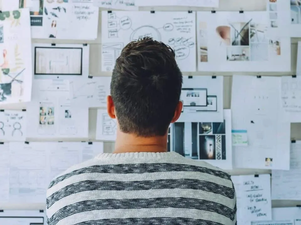 Person looking at wall of plans