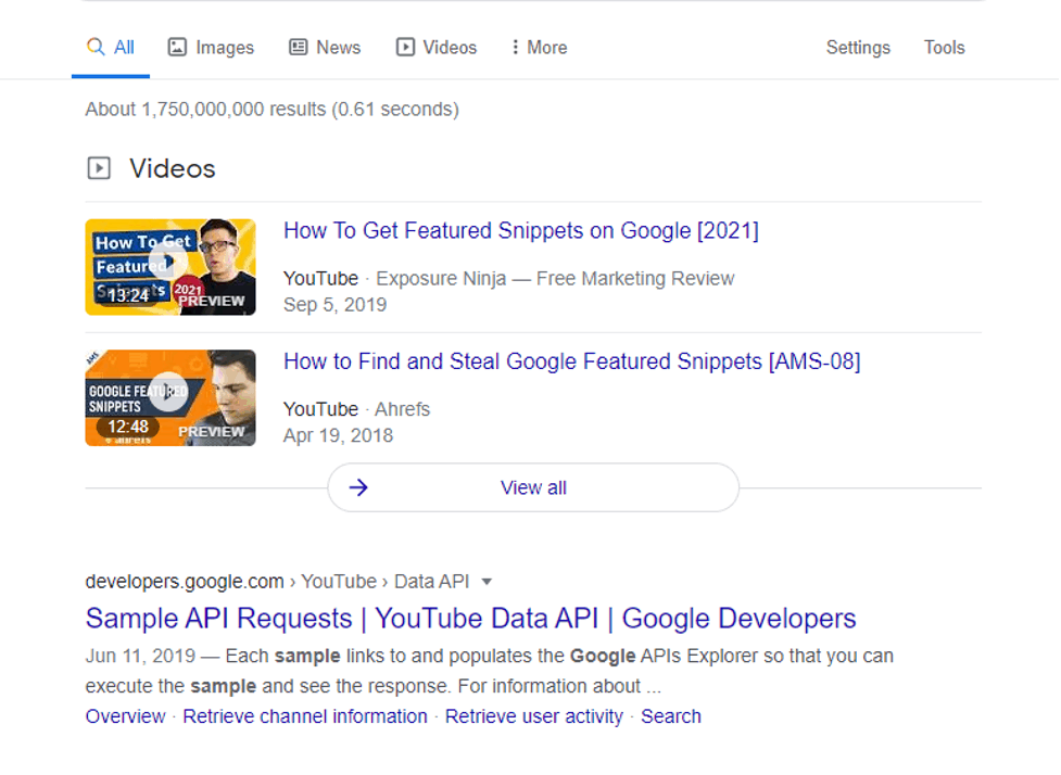 A screenshot of search result page displaying youtube videos at the top